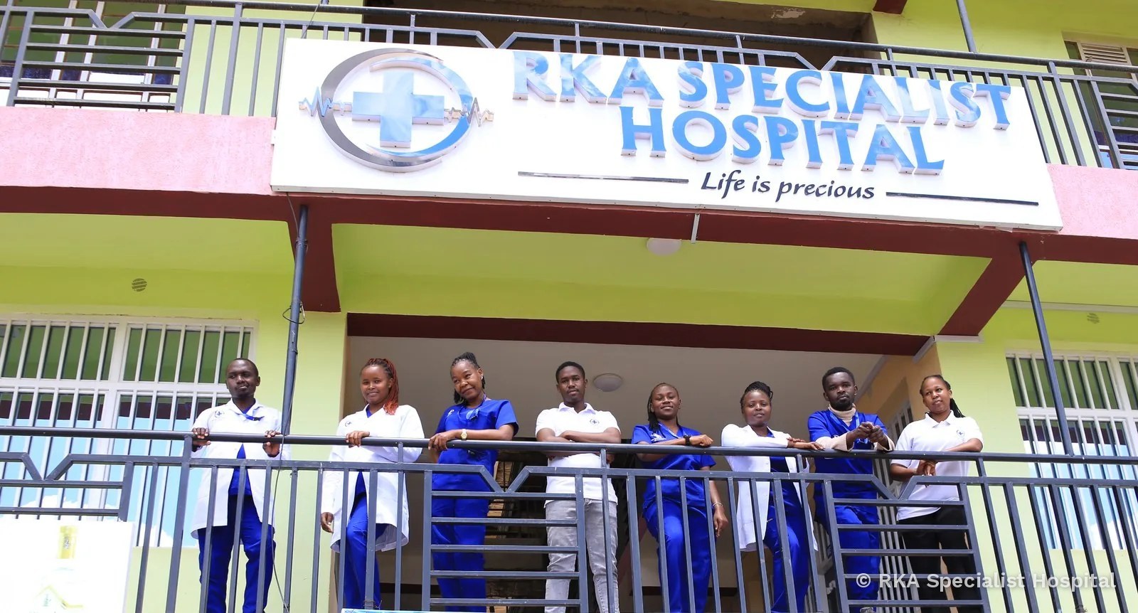 The RKA Specialist Hospital team on the balcony outside the hospital