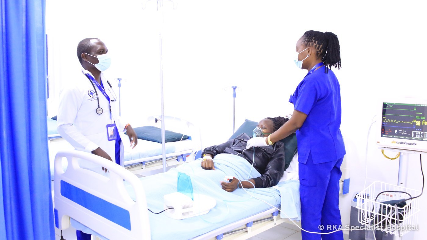 A doctor and nurse caring for a patient at RKA Specialist Hospital